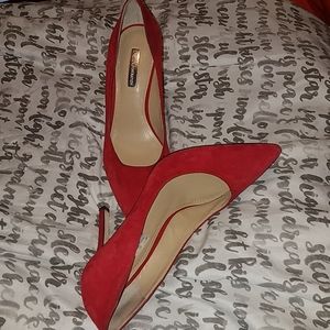 Red suede pumps